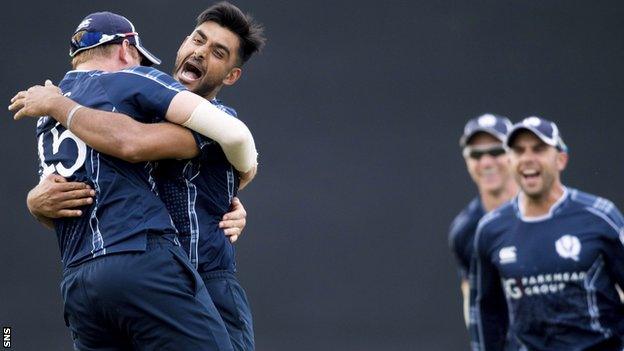 Scotland's Safyaan Sharif celebrates as Scotland win by six runs