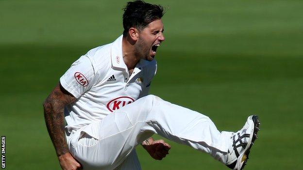 Jade Dernbach celebrates a wicket for Surrey