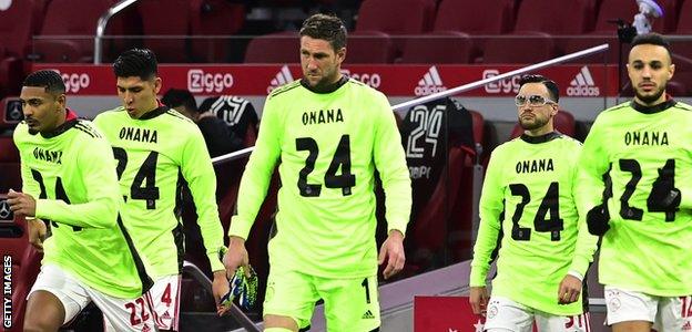 Ajax players wear shirts with 'Onana 24' on them in support of Andre Onana