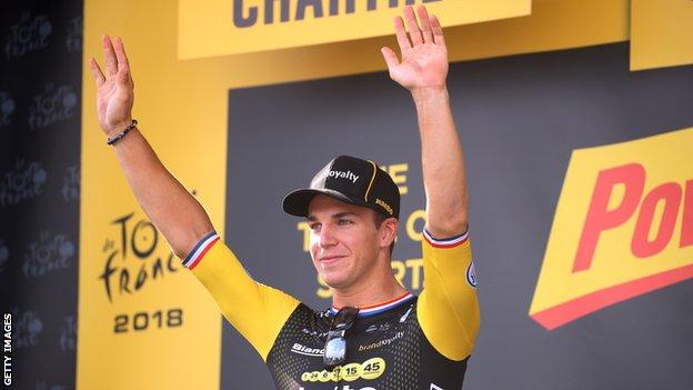 Dylan Groenewegen celebrates on the podium after winning stage seven of the 2018 Tour de France