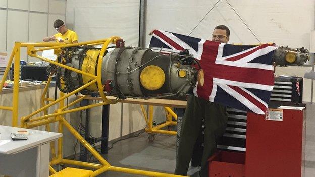 Young worker with aeroplane engine