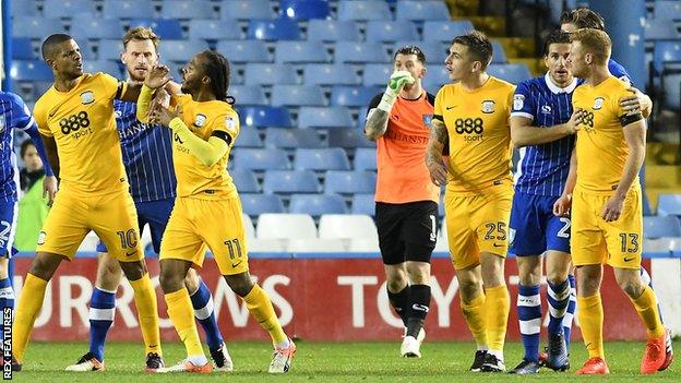 Jermaine Beckford (left) and Eoin Doyle (right) are pulled apart after coming to blows