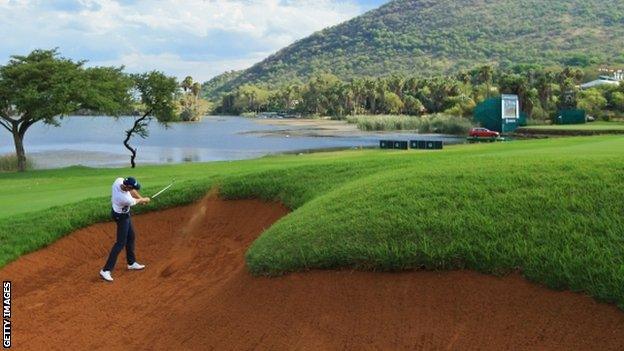 Henrik Stenson plays out of a bunker on the 17th