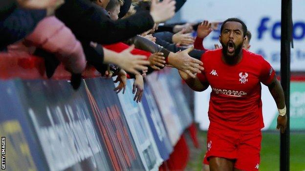 Ashley Hemmings celebrates with fans after scoring for Kidderminster Harriers against Grimsby in the first round of the FA Cup