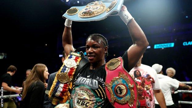 Claressa Shields lifts her belts up