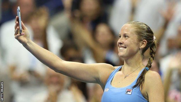 Shelby Rogers takes a selfie on court after beating Ash Barty