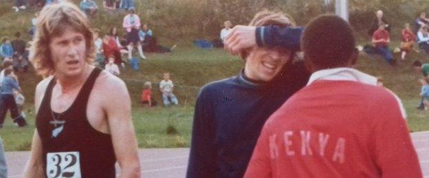 John McGuinness (centre) talks to Kenyan athlete Wilson Waigwa after the Morton Mile on 11 July in 1977 as race winner John Walker looks on