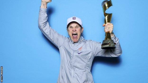 Jill Ellis celebrates with 2019 Women's World Cup trophy