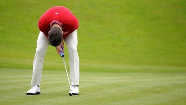 A golfer looks distraught