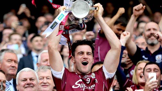 Galway captain David Burke lifts the Liam McCarthy Cup after the victory over Waterford