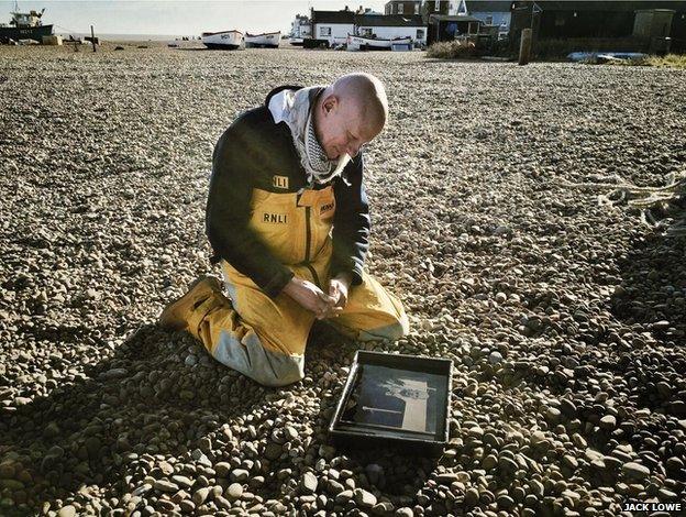 Steve Saint looking at his glass plate image