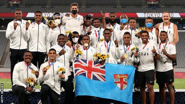 Gareth Baber is lifted up by the Fiji Rugby Sevens squad squad defended their Olympic crown in Tokyo