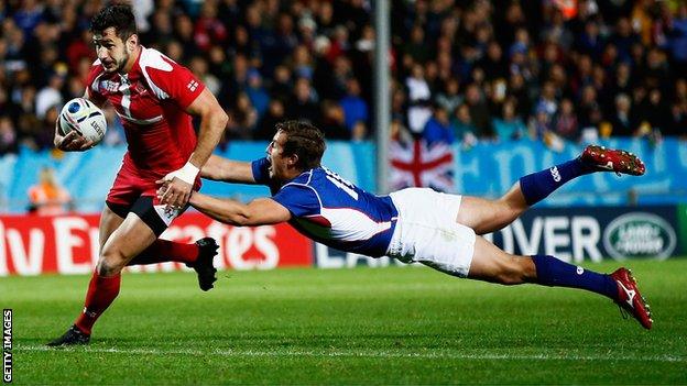 Georgia's Lasha Malaguradze scores a try against Namibia