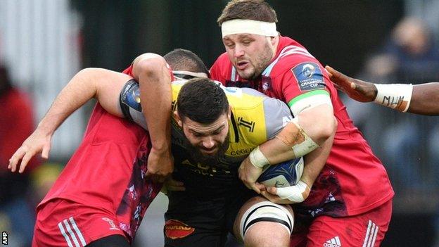 La Rochelle's Mathieu Tanguy is tacked by Harlequins