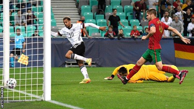 Lukas Nmecha scores for Germany against Portugal in the 2021 European Under-21 Championship final