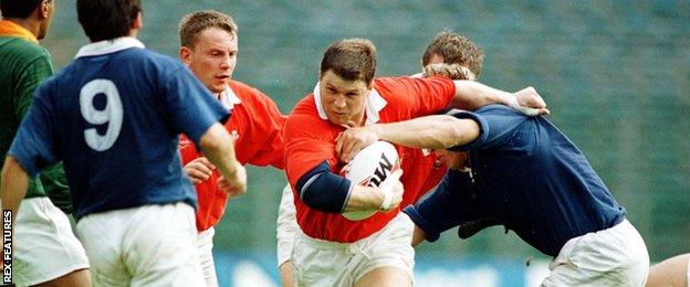 Scott Gibbs in action for Wales against Italy in October 1996