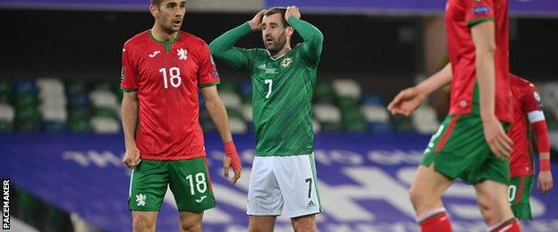 Niall McGinn reacts to a missed chance at Windsor Park