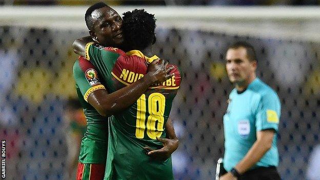 Vincent Aboubakar and Robert Ndip Tambe celebrate after Cameroon sealed a quarter-finals spot