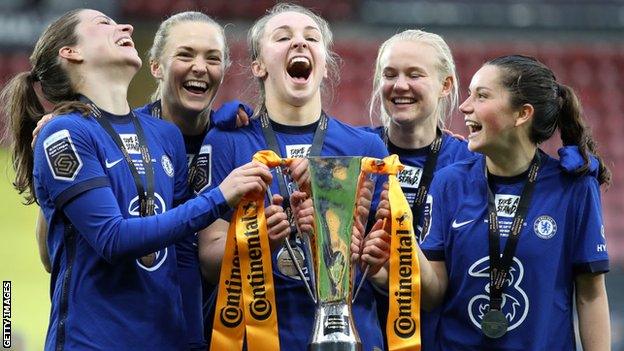 Niamh Charles celebrating winning the League Cup this season