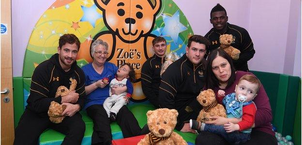 Wasps player visit Zoe's Hospice. From left, Danny Cipriani, Elaine Jakeman with baby James, Josh Bassett, Ben Harris, Claire Baines with baby Joel, Christian Wade