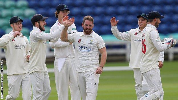 Glamorgan players celebrate a wicket during the pre-season fixture against Cardiff MCCU