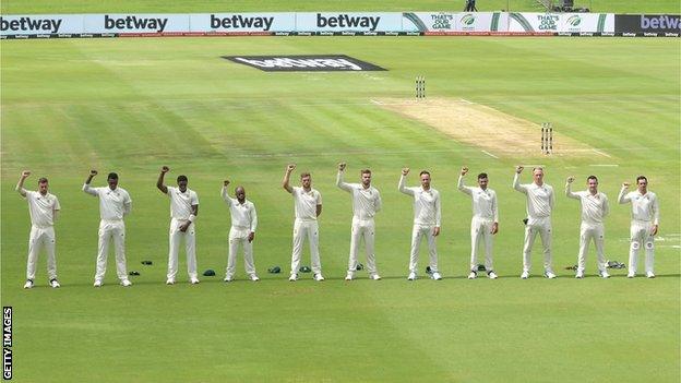 South Africa's cricketers raise their right fists in an anti-racism gesture before the first Test against Sri Lanka