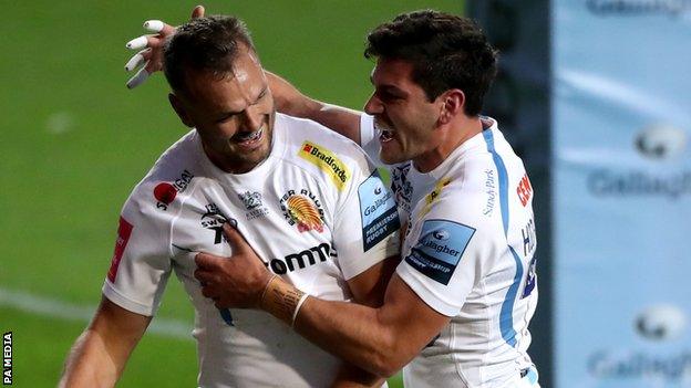 Phil Dollman (left) celebrates his try