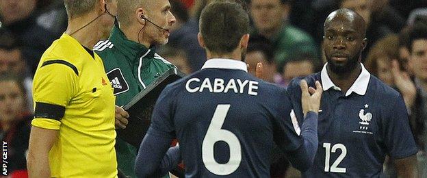 Lassana Diarra is applauded by the Wembley crowd