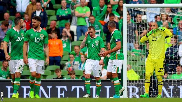 Darren Randolph (right) after gifting Uruguay their goal in Sunday's game in Dublin