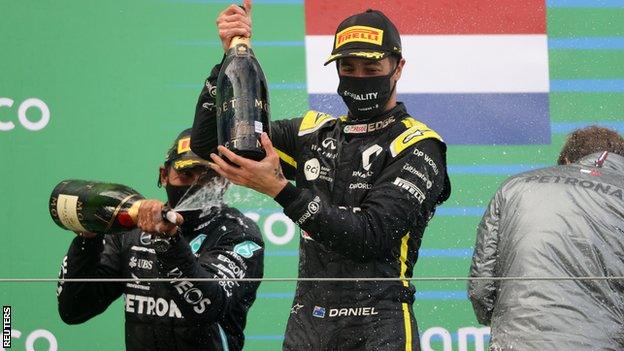 Daniel Ricciardo celebrates on the podium