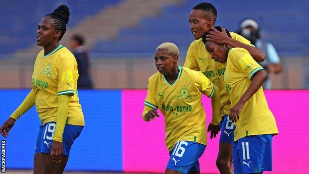 Lelona Daweti (centre) and her Mamelodi Sundowns team-mates celebrate a goal against Bayelsa Queens