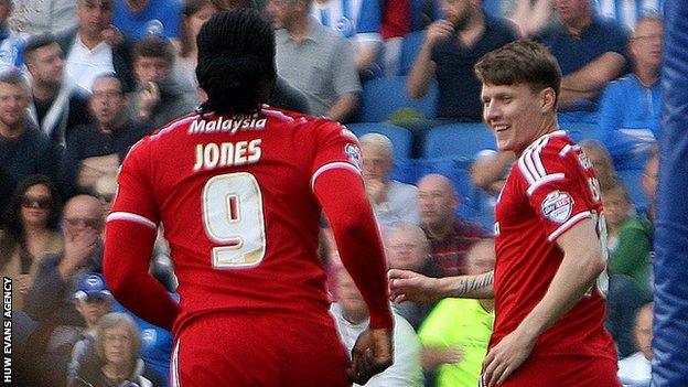 Joe Mason (R) celebrates his goal with Kenwyne Jones