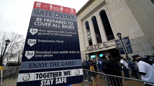 A sign at Yankee Stadium that tells fans the conditions for entry under Covid-19 protocols