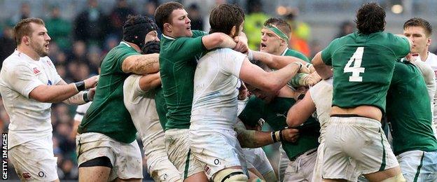 Donnacha Ryan grabs England lock Geoff Parling around the neck as a melee kicks off