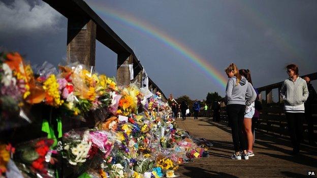 Floral tributes on a bridge near the A27