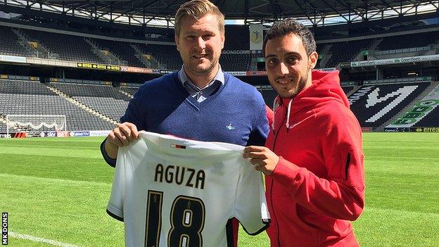 Sergio Aguza (right) with MK Dons boss Karl Robinson