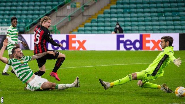 Jens Petter Hauge (centre) scores for AC Milan against Celtic