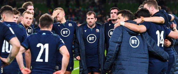 Fraser Brown at the centre of a Scotland team talk