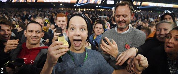 Fan celebrates being given Sonny Bill Williams medal