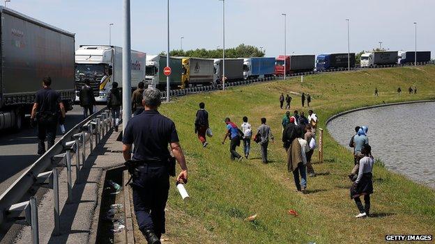 Migrants at motorway side