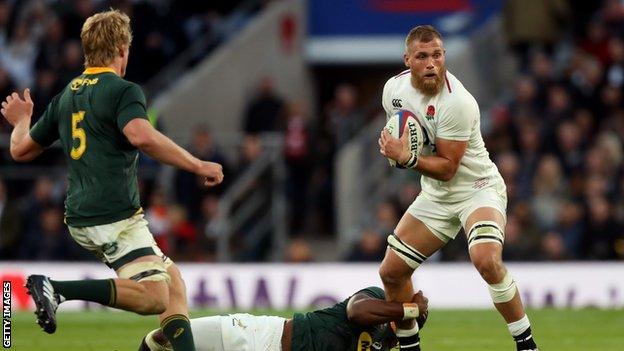 Brad Shields grapples for the ball against South Africa