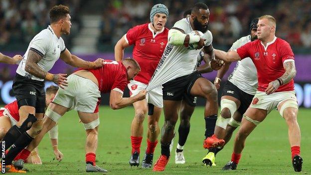 Semi Radradra bursts through the Wales defence