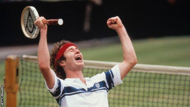 John McEnroe waves both hands in the air after winning the 1981 Wimbledon final