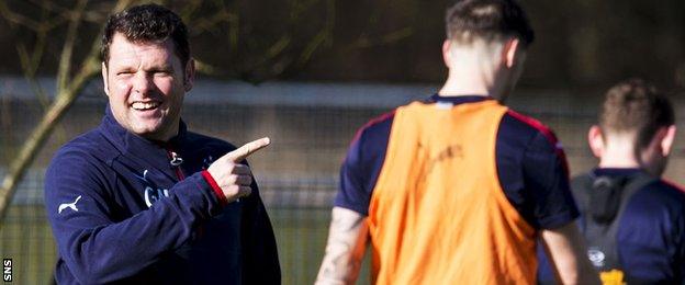 Rangers caretaker Graeme Murty shares a joke during Monday training