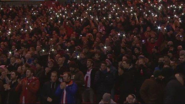 Lincoln fans paid tribute to Graham Taylor between the 75th and 76th minutes - marking the 1975-76 season when he led them to the Fourth Division title and the fourth round of the FA Cup