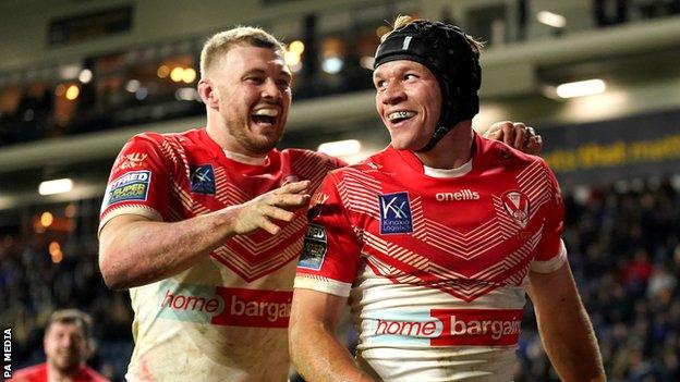 Jonny Lomax celebrates scoring a try