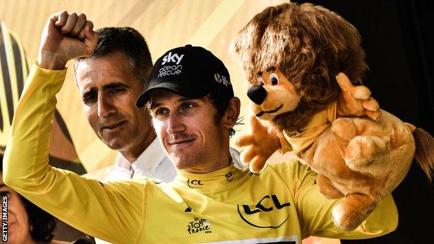 Geraint Thomas celebrates on the podium after the penultimate stage of the Tour de France