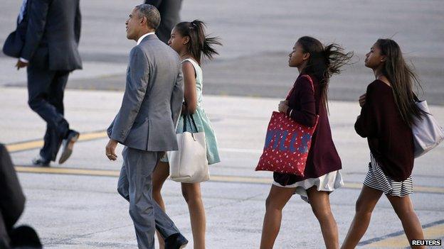 Mr Obama shows his daughter around New York - under tight security