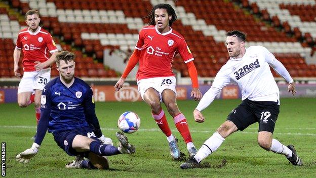 Lee Gregory shoots at goal for Derby against Barnsley