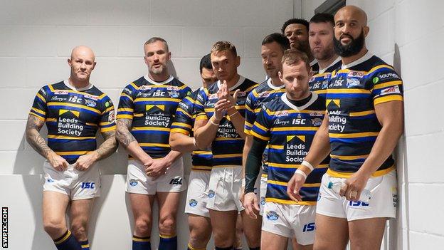 Kevin Sinfield and Rob Burrow wait with other ex-Leeds teammates to go on in the testimonial game